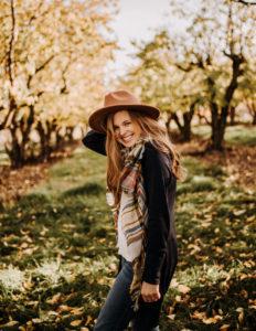 Student poet Lydia 霍夫曼 outside in Fall with hat